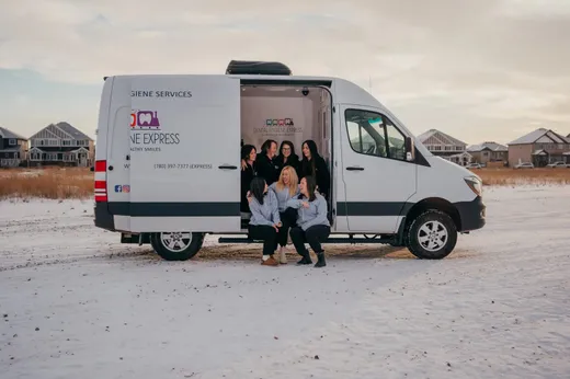 Dental Hygiene Express staff beside the clinic van
